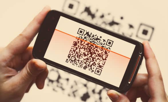 a-person-holding-a-smartphone-to-scan-qr-code