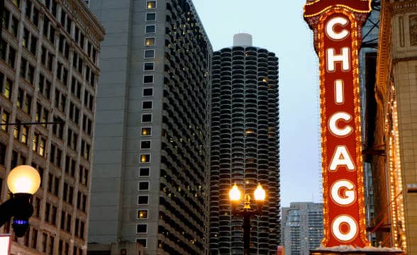 A sign in downtown Chicago in the dusk that says "Chicago"