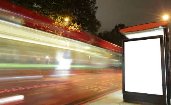 Blank billboard at a bus stop to be used for advertisement.