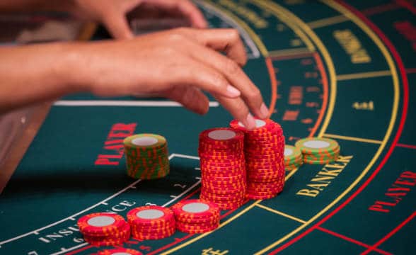 baccarat-table-with-dealer-adjusting-the-chips