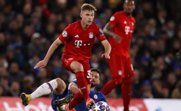 Joshua Kimmich of Bayern Munich having overcome an opponent and moving the ball forward.