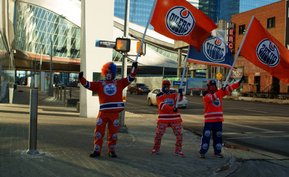 Edmont Oilers' fans, waving the team's fanfare.