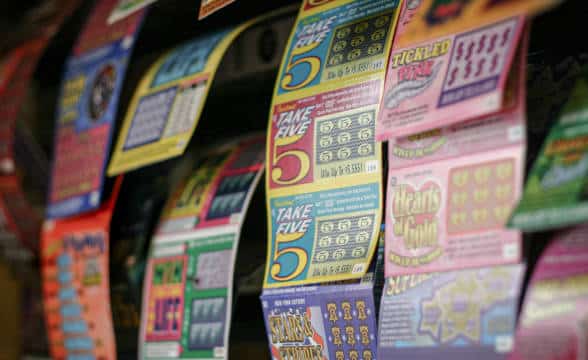 Lottery tickets put on a wall for people to draw from.