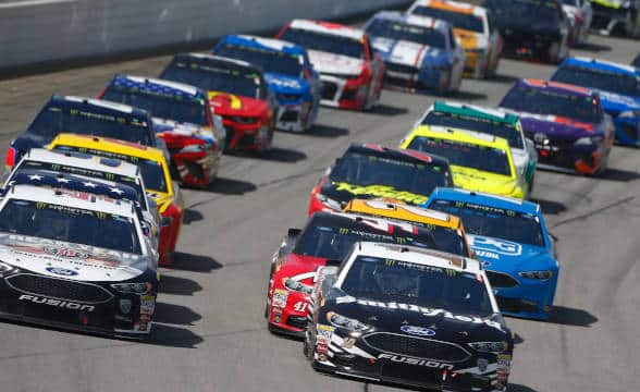 NASCAR cars in a raceway.