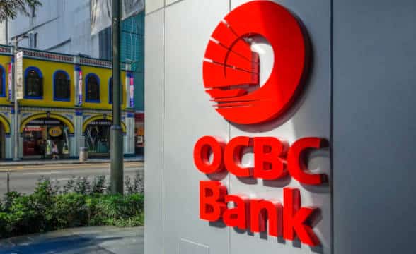 The OCBC Bank logo on a building in Singapore, probably the bank branch itself.