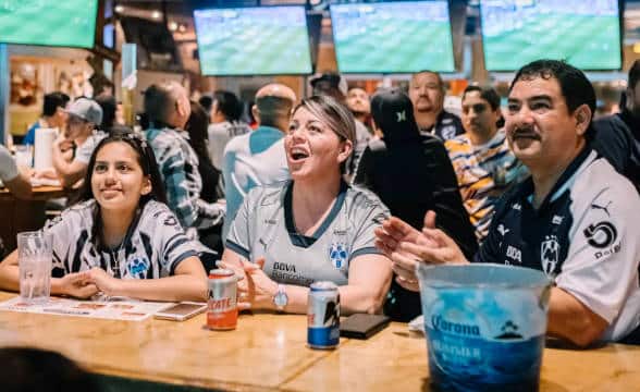 A family sitting at an Ojos Locos venue.