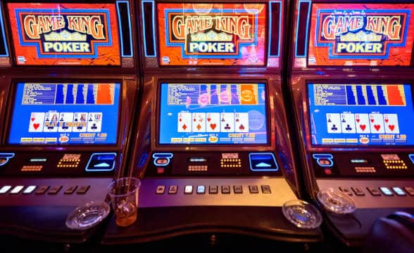 Video poker machines sitting lit up and unused.