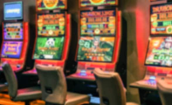 Pokie machines in a gambling parlor.