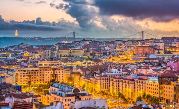 The skyline over Lisbon, Portugal at dusk.