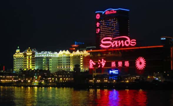 Sands China as seen from the waterfront in Macau during nighttime.