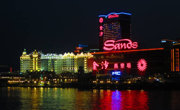 Sands China in Macau at night and light in neon.