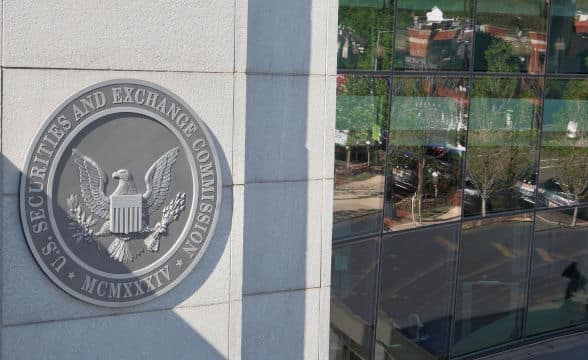 Securities and Exchange Commission logo outside a SEC building in the USA.