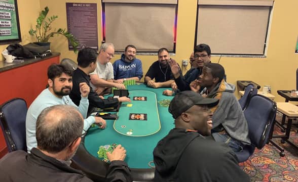 Players at a card table in the Stars Casino in Tracy California