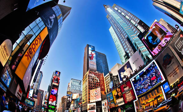 Times Sqaure, a photo from the center of the square looking up towards the high rises.