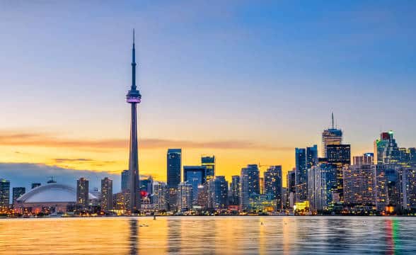 The Toronto skyline in Ontario during sunset.