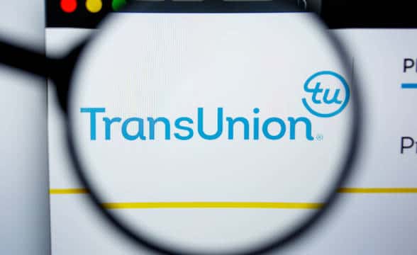 TransUnion's official site logo seen through a magnifying glass.