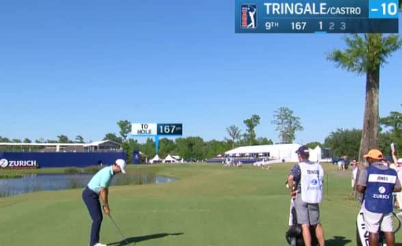 A man at the PGA Tour Zurich Classic taking a swing at a golf ball.