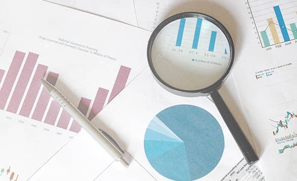 A researcher's desk shows survey results