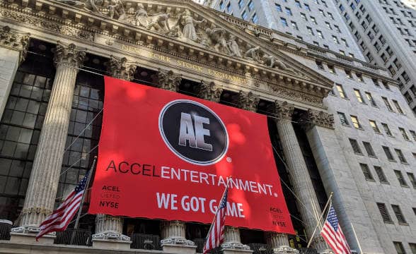 An Accel Entertainment marketing banner with the company's motto put on the NYSE building.