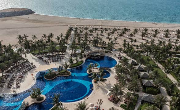 Al Marjan Island and the swimming pool of the Hilton Hotel there.