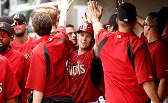 Arizona Diamondbacks' Owings high fives his teammates