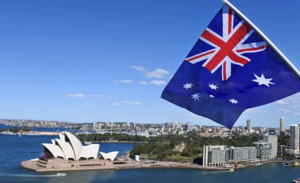 Australia's Sydney Opera House with a flag of Australia seen in the photo.