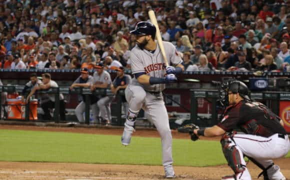 Houston Astros' player taking a swing with his bat.