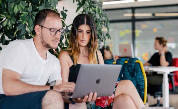 Catena Media employees sitting in the office.