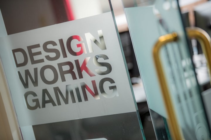 Design Works Gaming official logo in the company's offices.