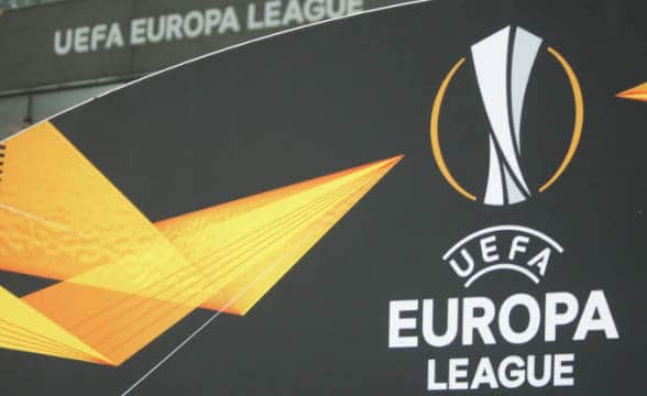 The UEFA Europa League logo on an advertisement panel.