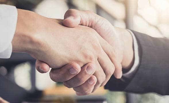 A handshake representing an agreement between two parties