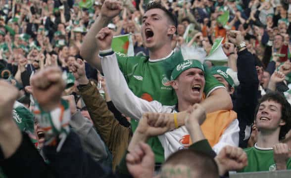 Irish soccer fans watching a live game.