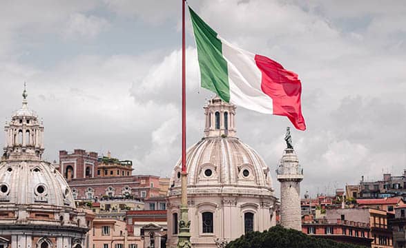 Italy's flag on a stormy sky