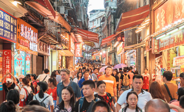 People in Macau, China, walking around.