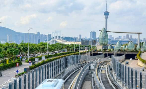 A macau train station with the railroad running.