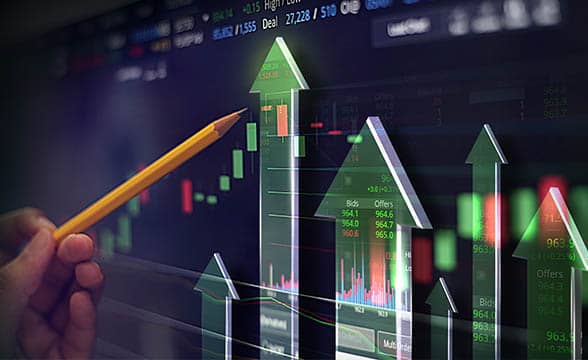 Person studies a chart showing market fluctuations