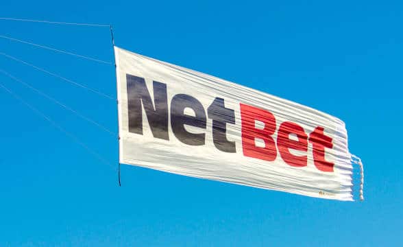 A NetBet marketing poster in the air.