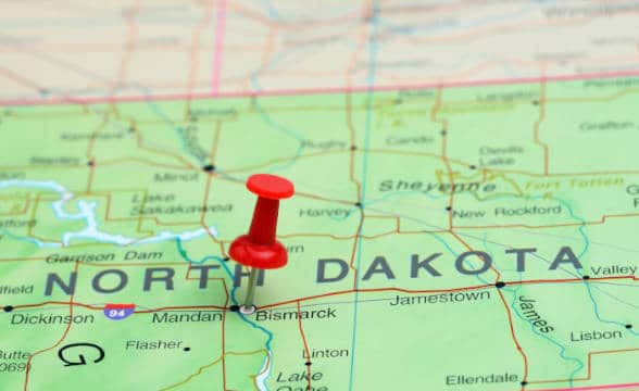 A map with North Dakota displayed and a pin on it.