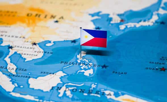 The Philippines national flag pinpointed in a map of the Philippines.