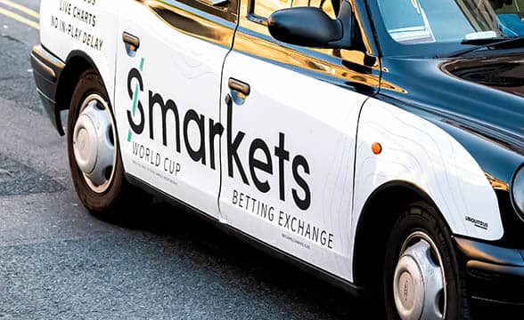 Smarkets' logo appears on a car