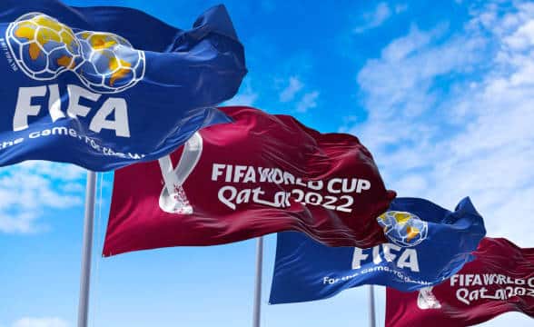 The official Qatar World Cup 2022 and FIFA flags.