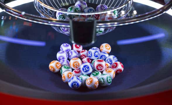 A bunch of lottery balls being drawn.