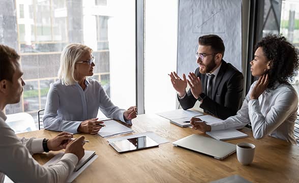 Businesspeople negotiate on a table