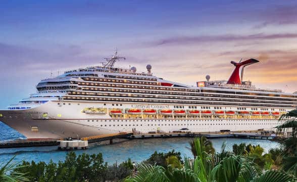 Carnival Cruises ship docked in a shipyard.