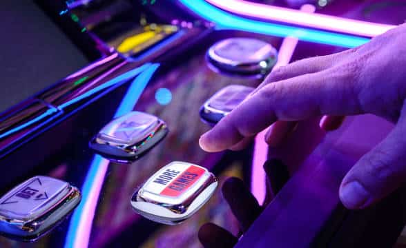 Gambling machines with a person pressing a button.