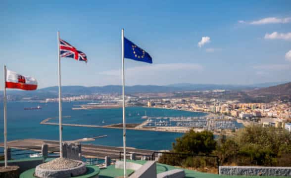 The Gibraltar flag alongside the European and UK flags.