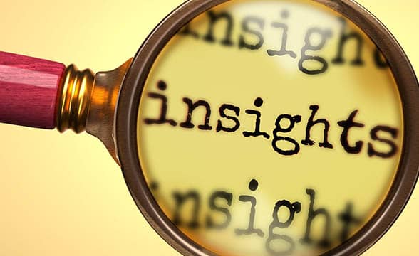 A magnifying glass zooms "insights" word