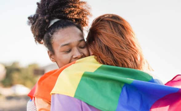 LGBTQ members hugging each other.