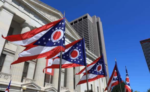 Ohio's state flags and official building in the state.