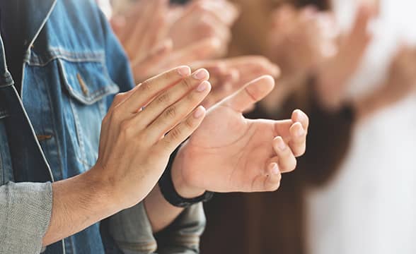 People clap to celebrate an occasion